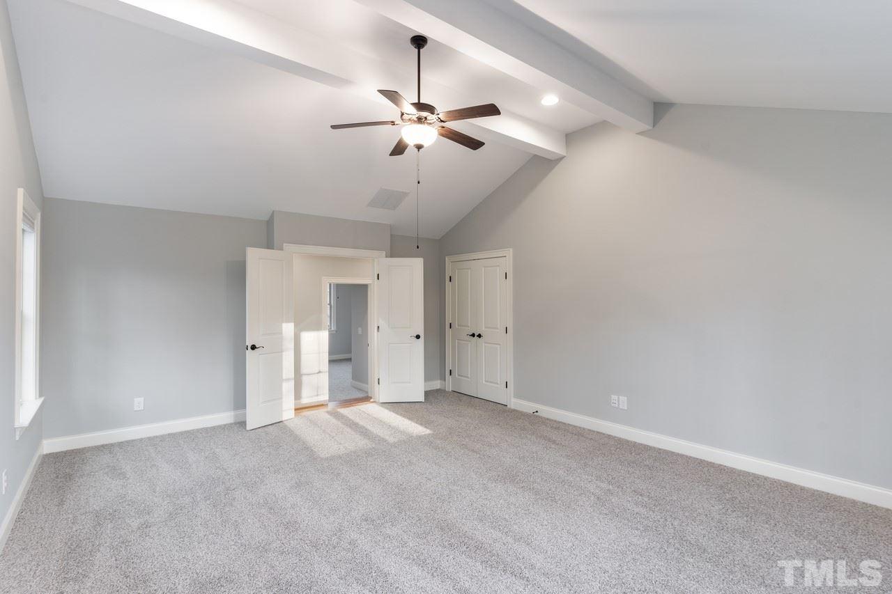 8505 Wynhurst Court Raleigh, NC 27613 - Photo 21 of 30 a view of an empty room with a chandelier fan