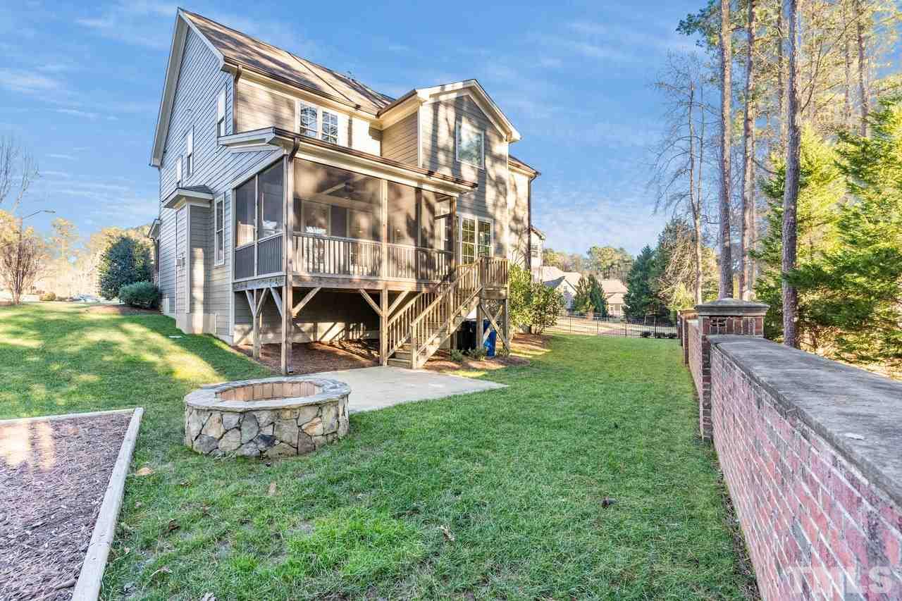 8505 Wynhurst Court Raleigh, NC 27613 - Photo 29 of 30 a view of a big house with a big yard and large trees