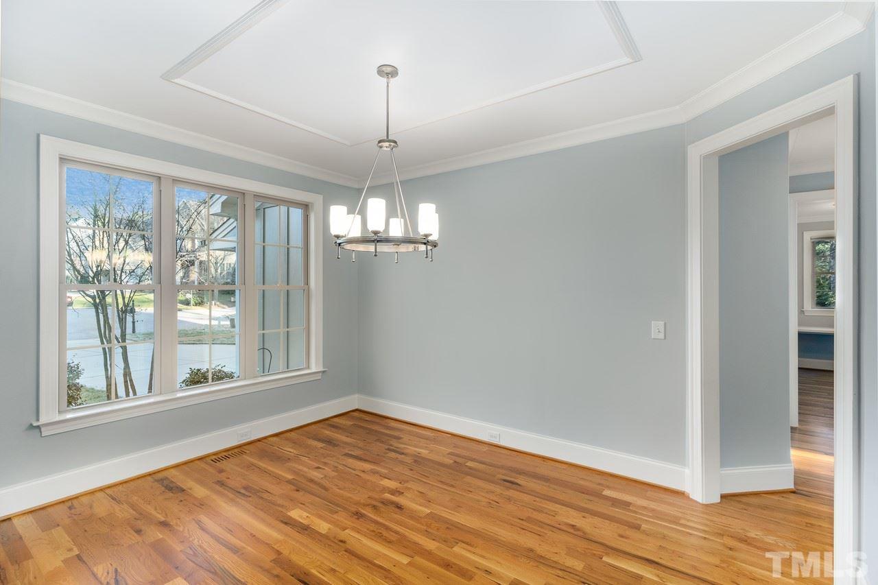 8505 Wynhurst Court Raleigh, NC 27613 - Photo 10 of 30 a view of empty room with wooden floor fan and window