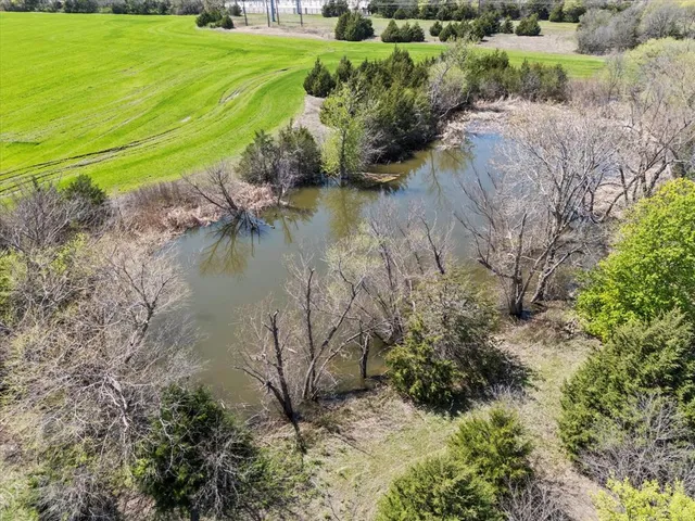 a view of a lake with a yard