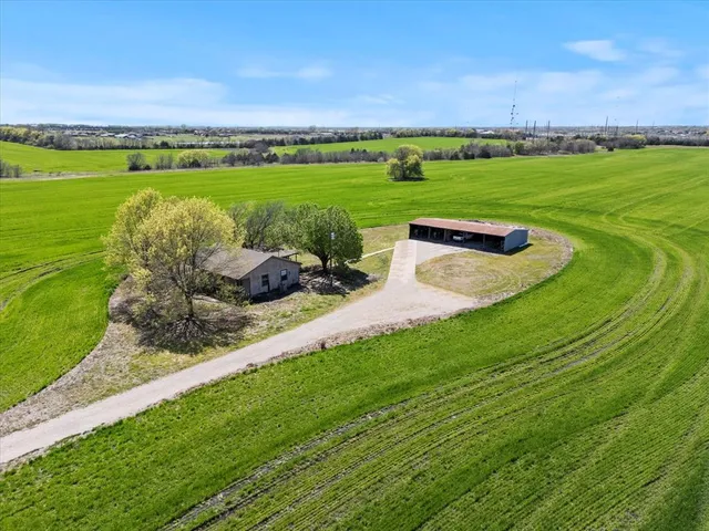 a view of a green field with clear sky