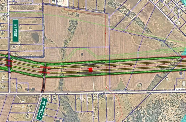 a view of a balcony with wooden floor and fence