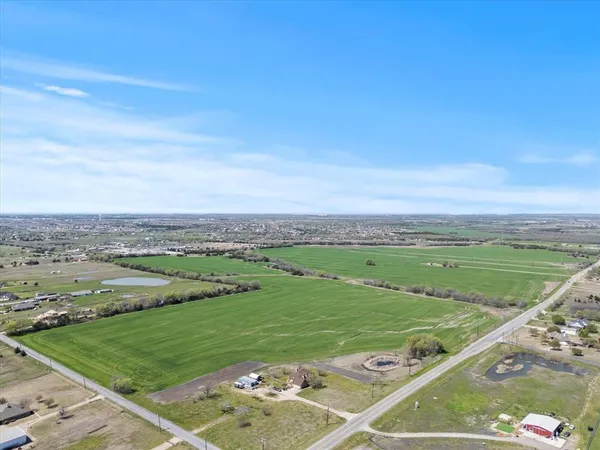a view of a grassy field with grassy field