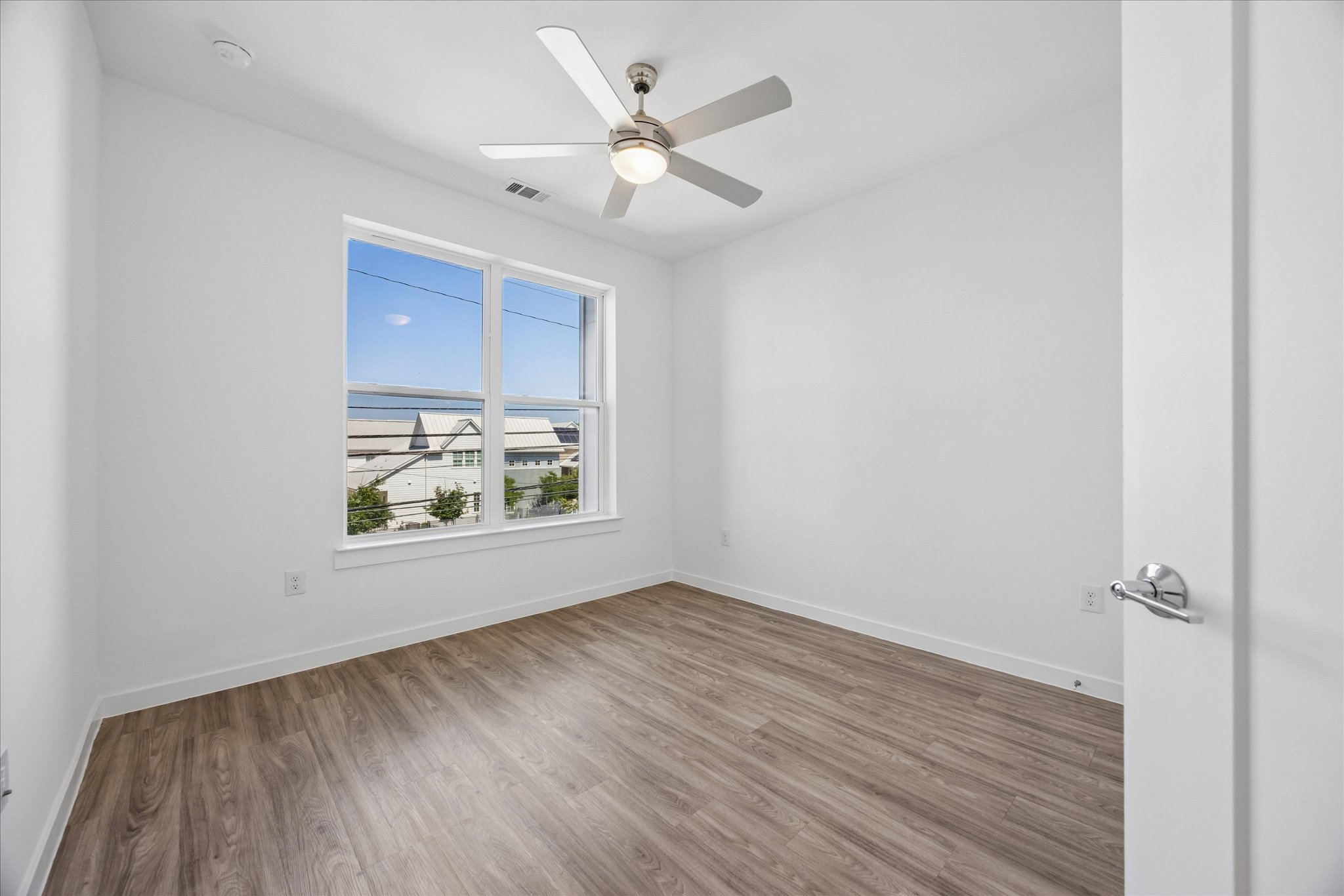 4801 Springdale Road, Unit 2210 Austin, TX 78723 - Photo 8 of 14 The primary bedroom allows plenty of light and has access to the balcony