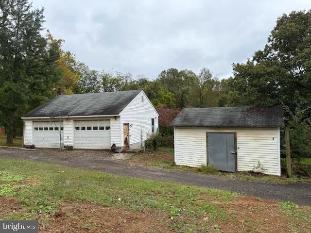 10891 Bethesda Church Road Damascus, MD 20872 - Photo 38 of 51 a view of a house with a yard and garage