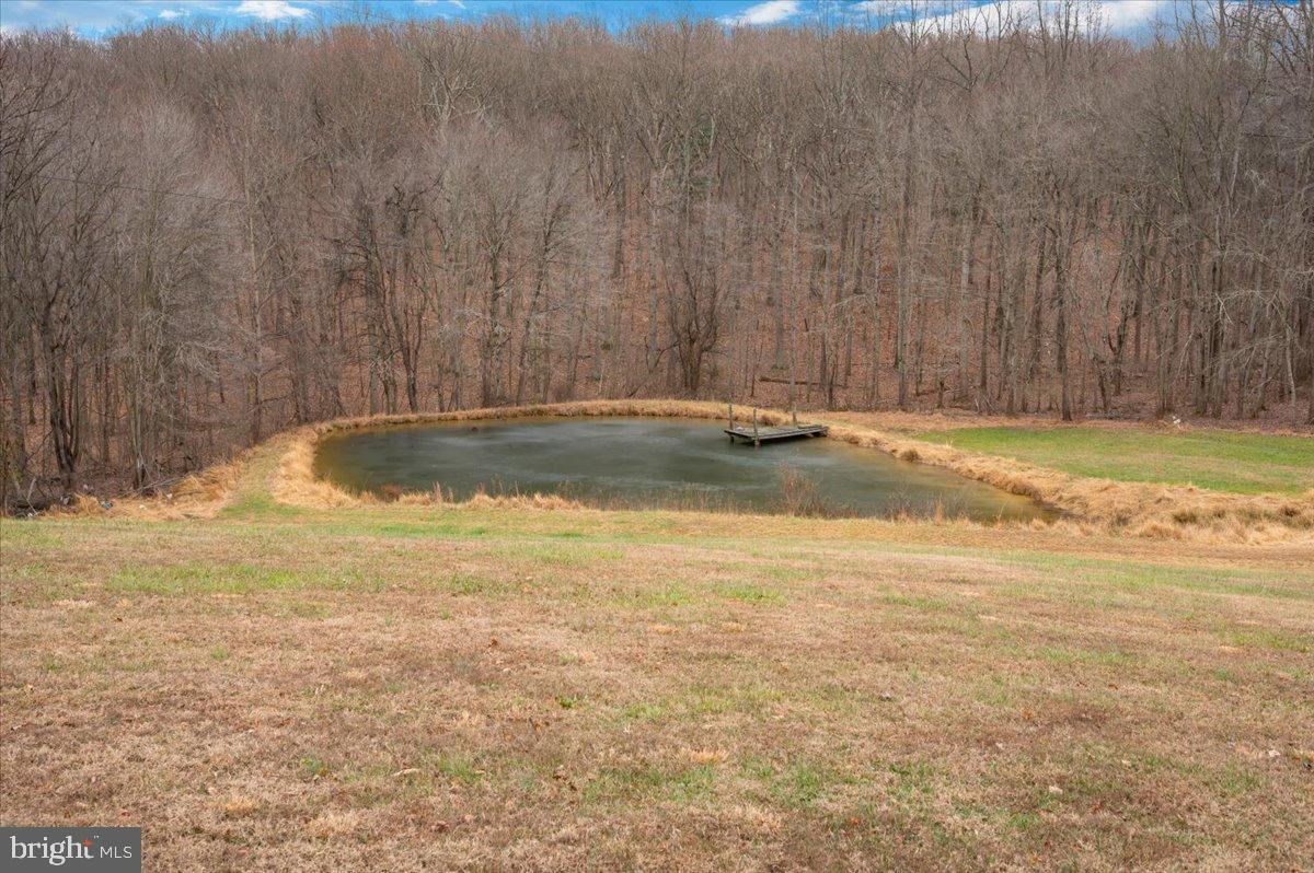 10891 Bethesda Church Road Damascus, MD 20872 - Photo 43 of 51 a view of a swimming pool with an outdoor space and seating area