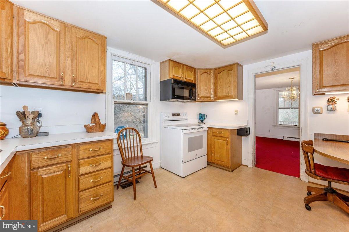 10891 Bethesda Church Road Damascus, MD 20872 - Photo 7 of 51 a kitchen with sink cabinets and window