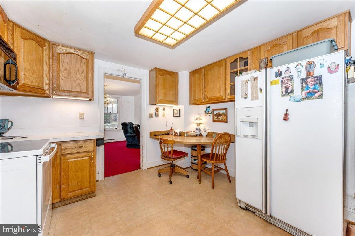 10891 Bethesda Church Road Damascus, MD 20872 - Photo 8 of 51 a view of kitchen with stainless steel appliances granite countertop a refrigerator and a stove top oven