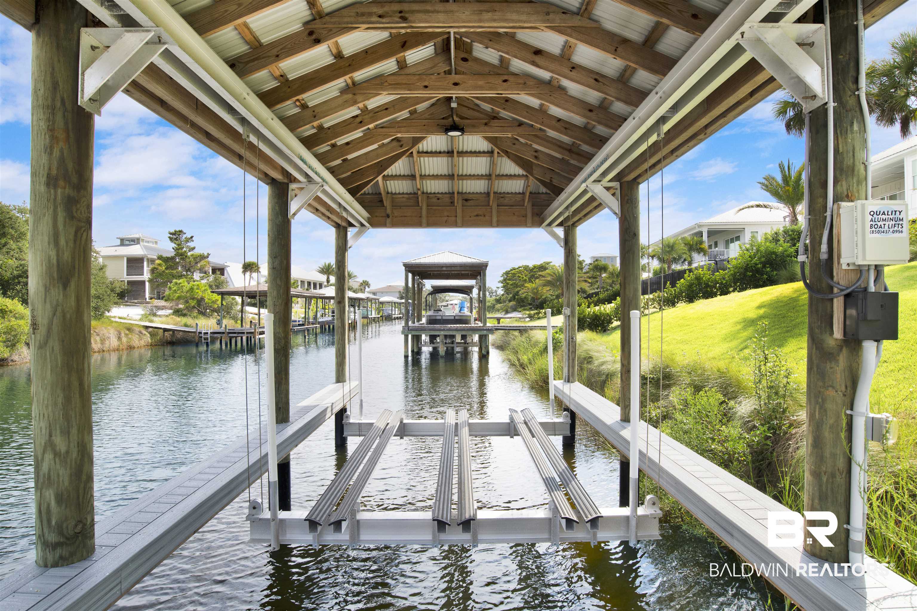 30239 Canal Court Orange Beach, AL 36561 - Photo 67 of 70 Dock area featuring boat lift and a water view