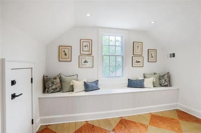 a living room with furniture and window