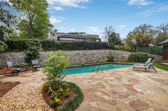 a view of a garden with sitting area