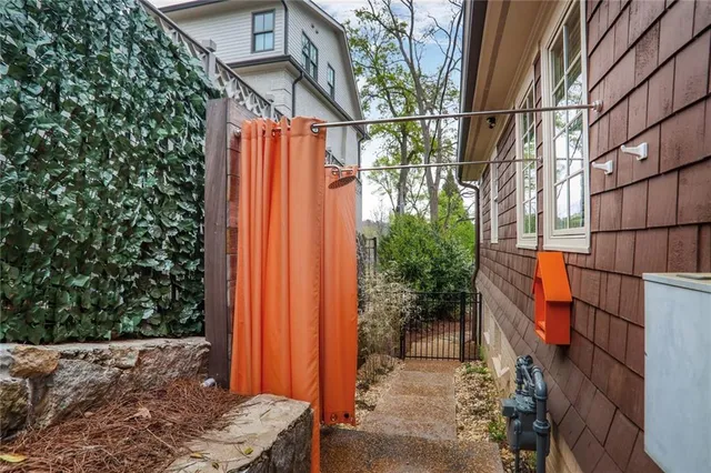 an aerial view of a house with a yard and trees