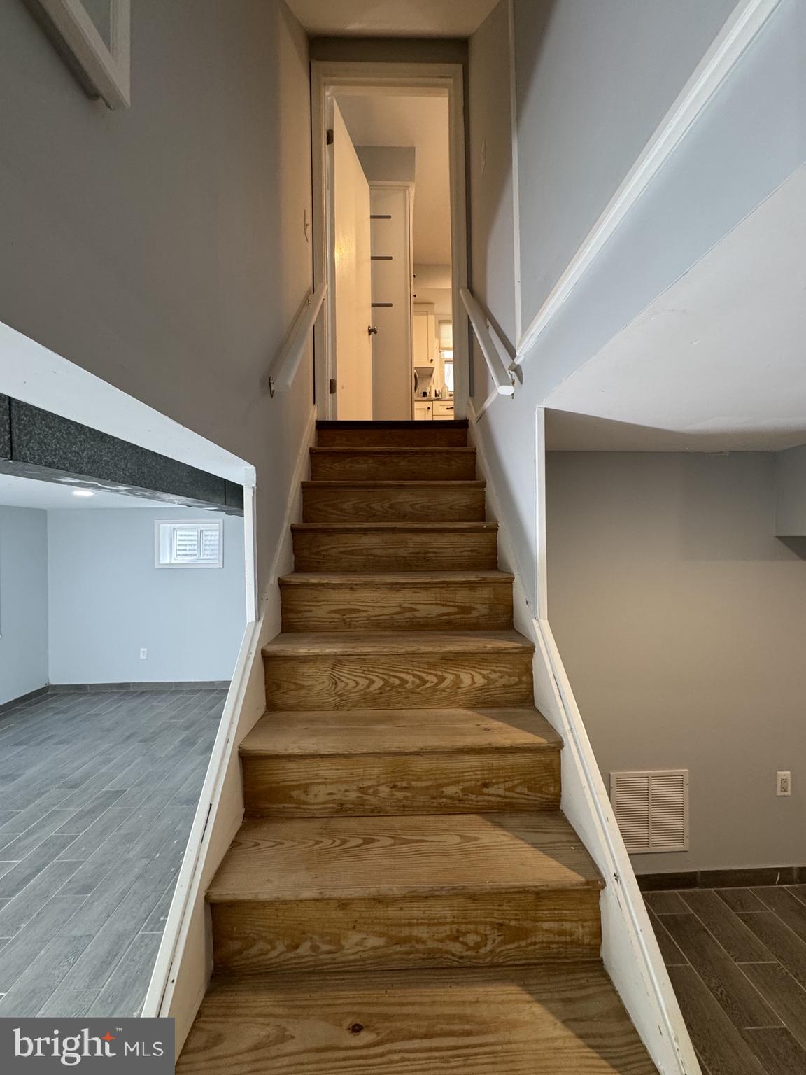 6603 Huntsman Boulevard Springfield, VA 22152 - Photo 45 of 64 Inviting staircase to modern living.
