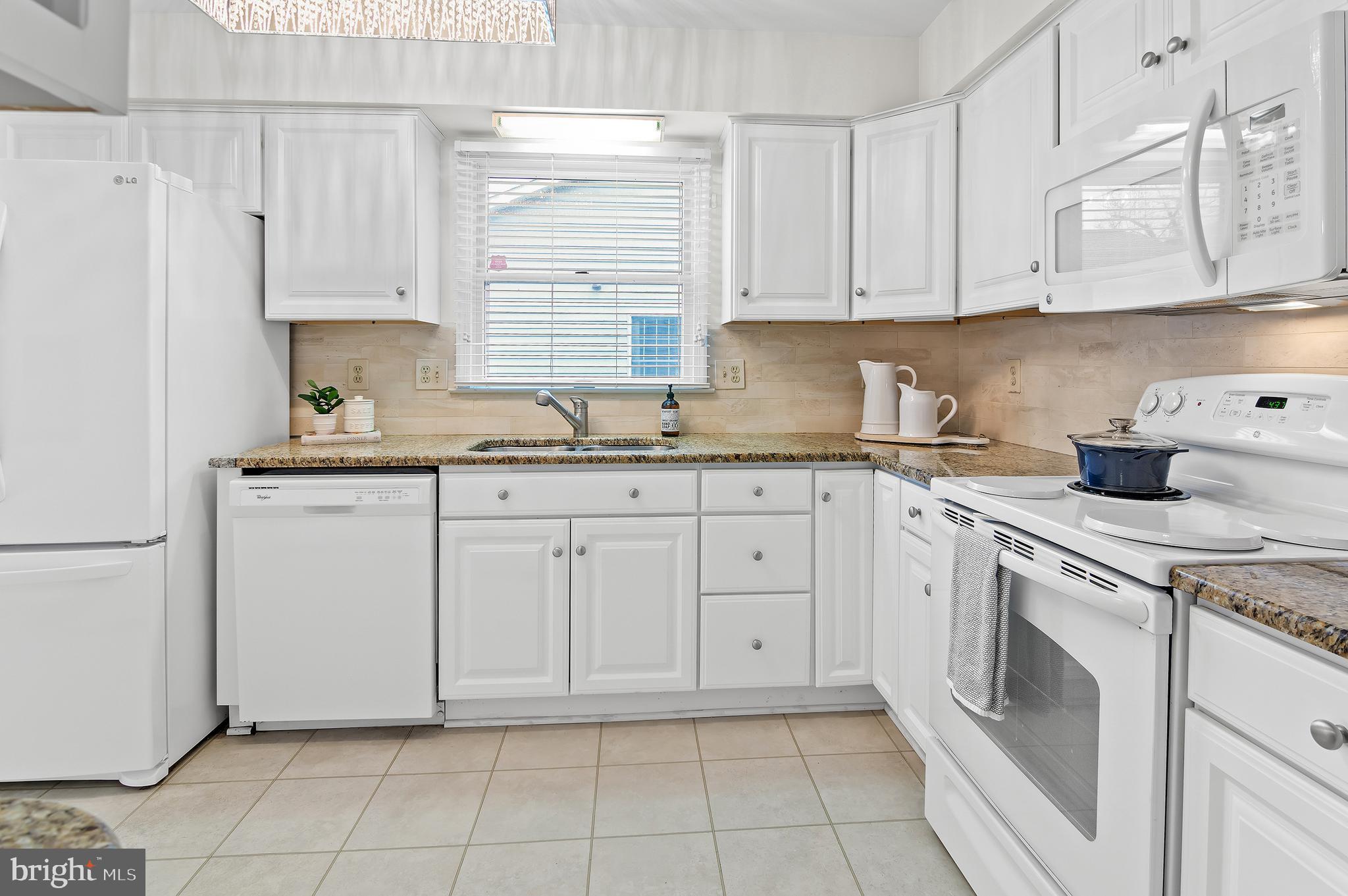 Granite counters, tile backsplash, updated light