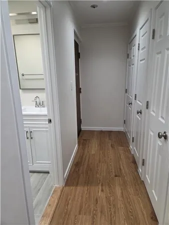 a view of a room with wooden floor and staircase