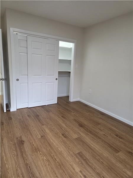 1000 Lexington Street, Unit 36 Waltham, MA 02451 - Photo 8 of 10 a view of empty room with wooden floor