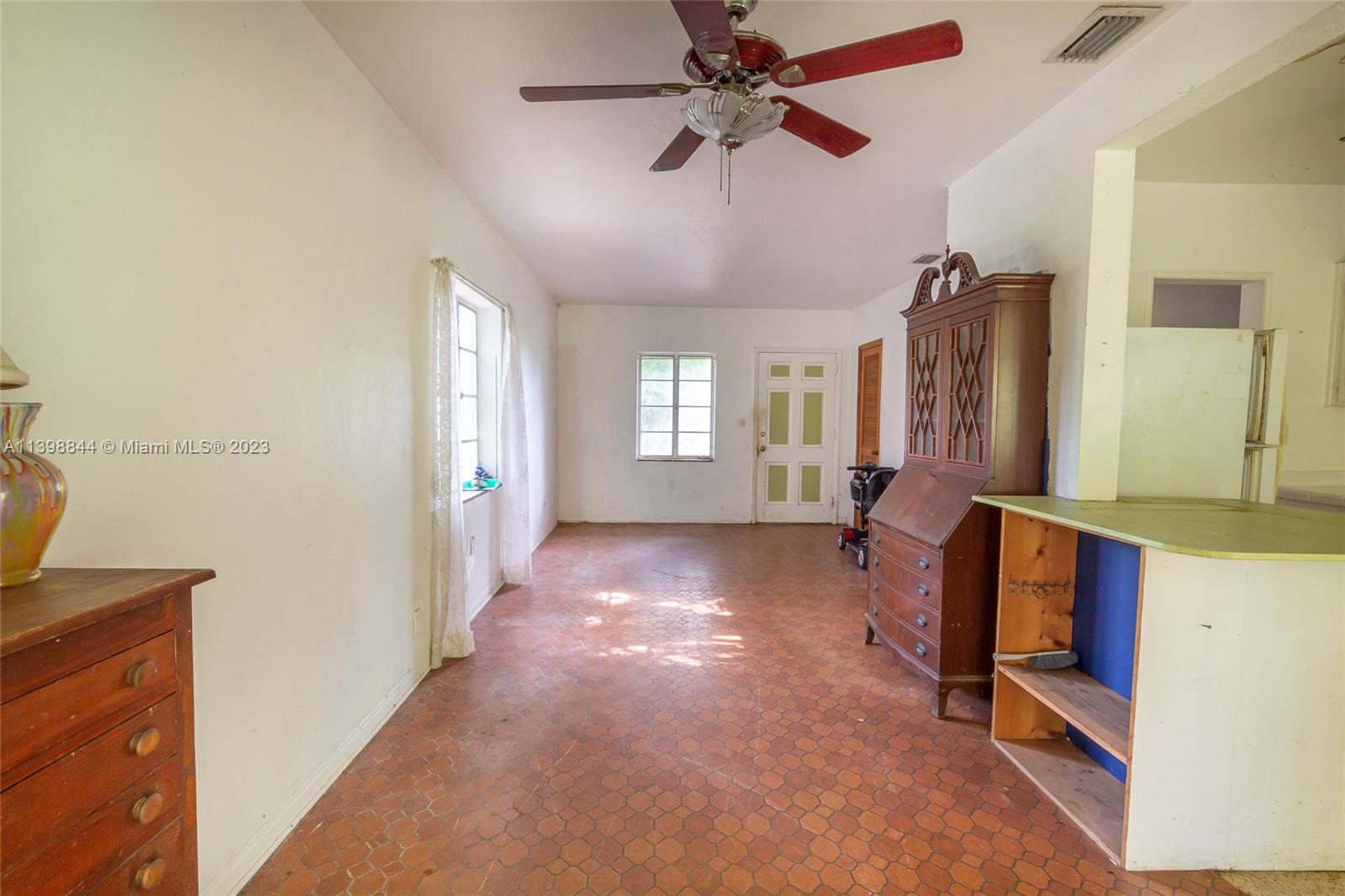 6600 Southwest 45th Street Miami, FL 33155 - Photo 11 of 27 a view of a hallway with windows and chandelier fan