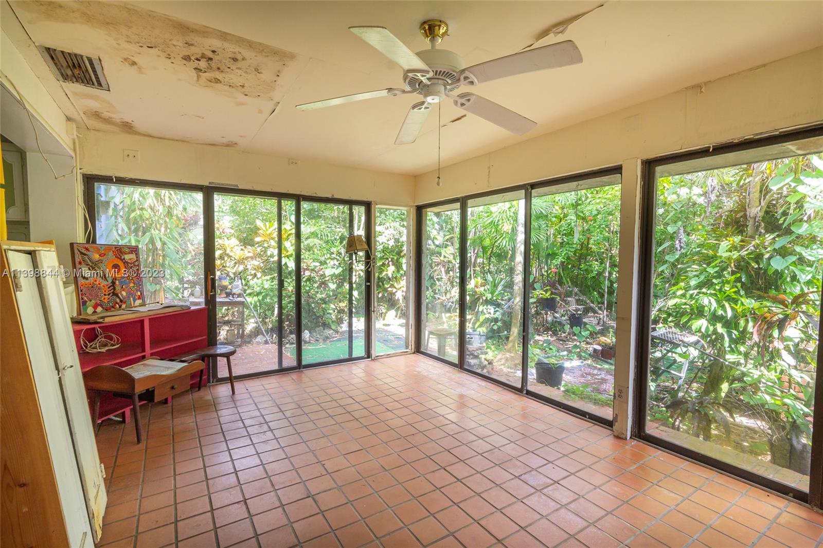 6600 Southwest 45th Street Miami, FL 33155 - Photo 14 of 27 a bedroom with furniture and a large window