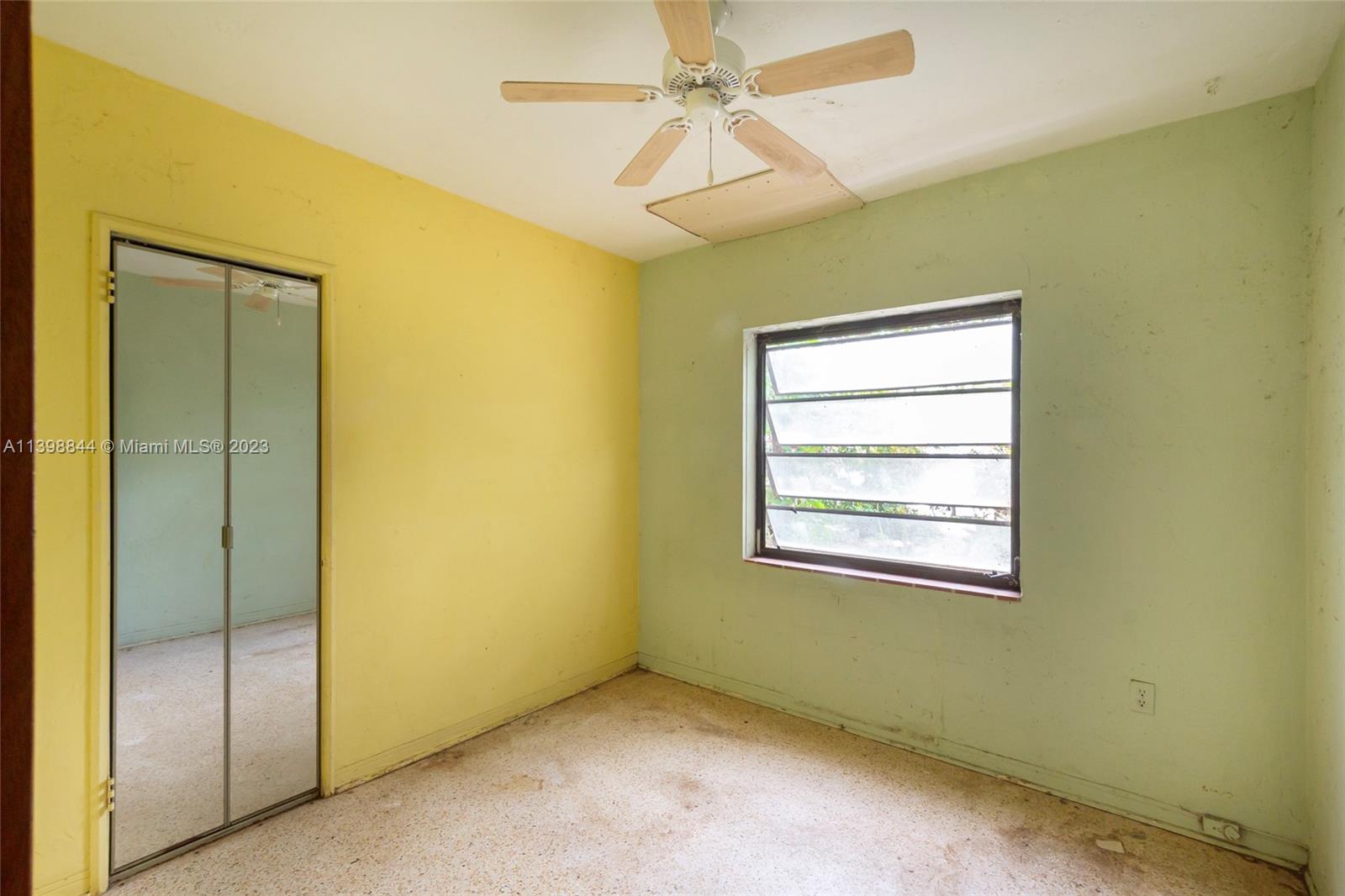 6600 Southwest 45th Street Miami, FL 33155 - Photo 20 of 27 an empty room with a ceiling fan and a window