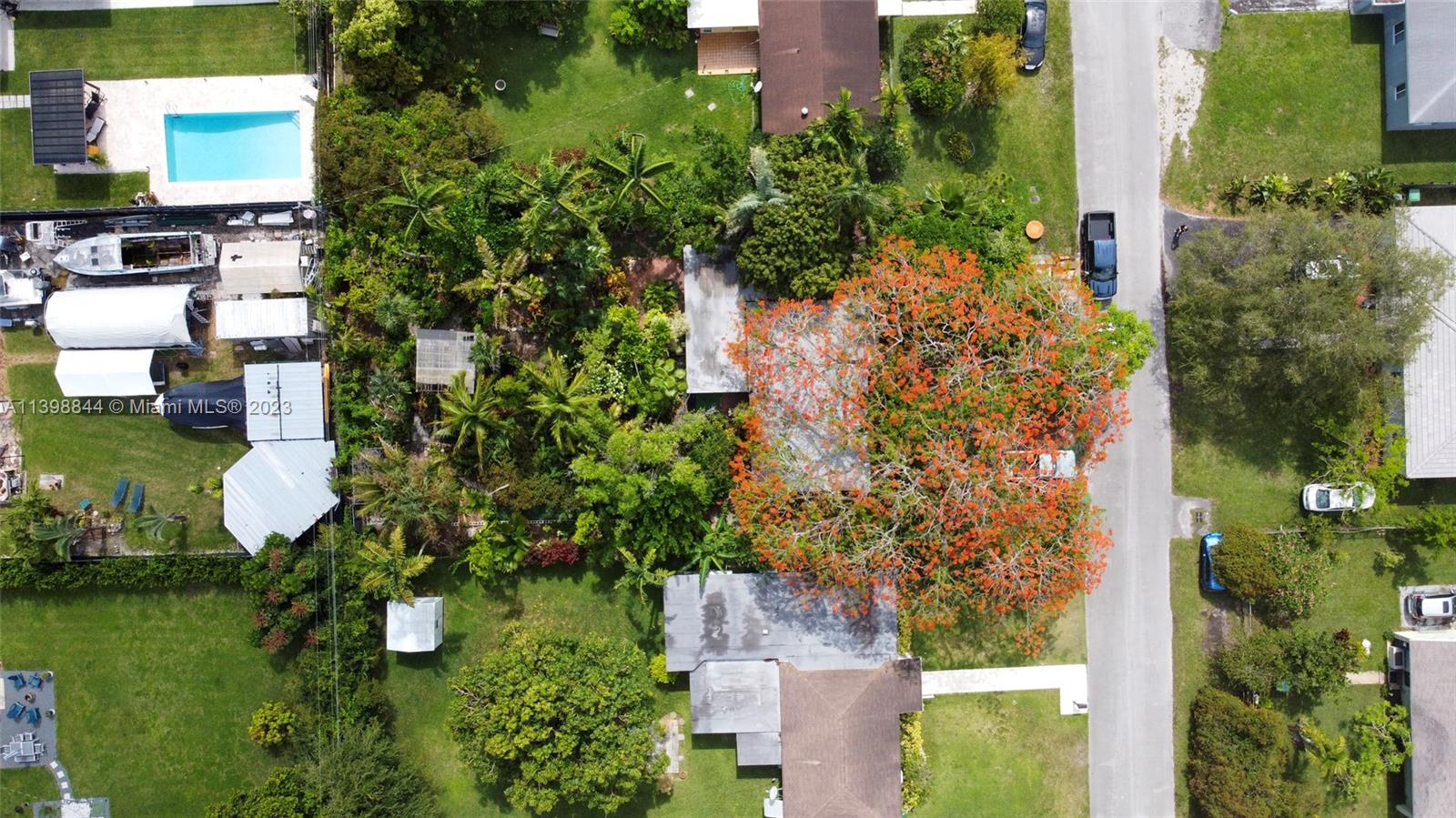 6600 Southwest 45th Street Miami, FL 33155 - Photo 2 of 27 an aerial view of a house with yard swimming pool and outdoor seating