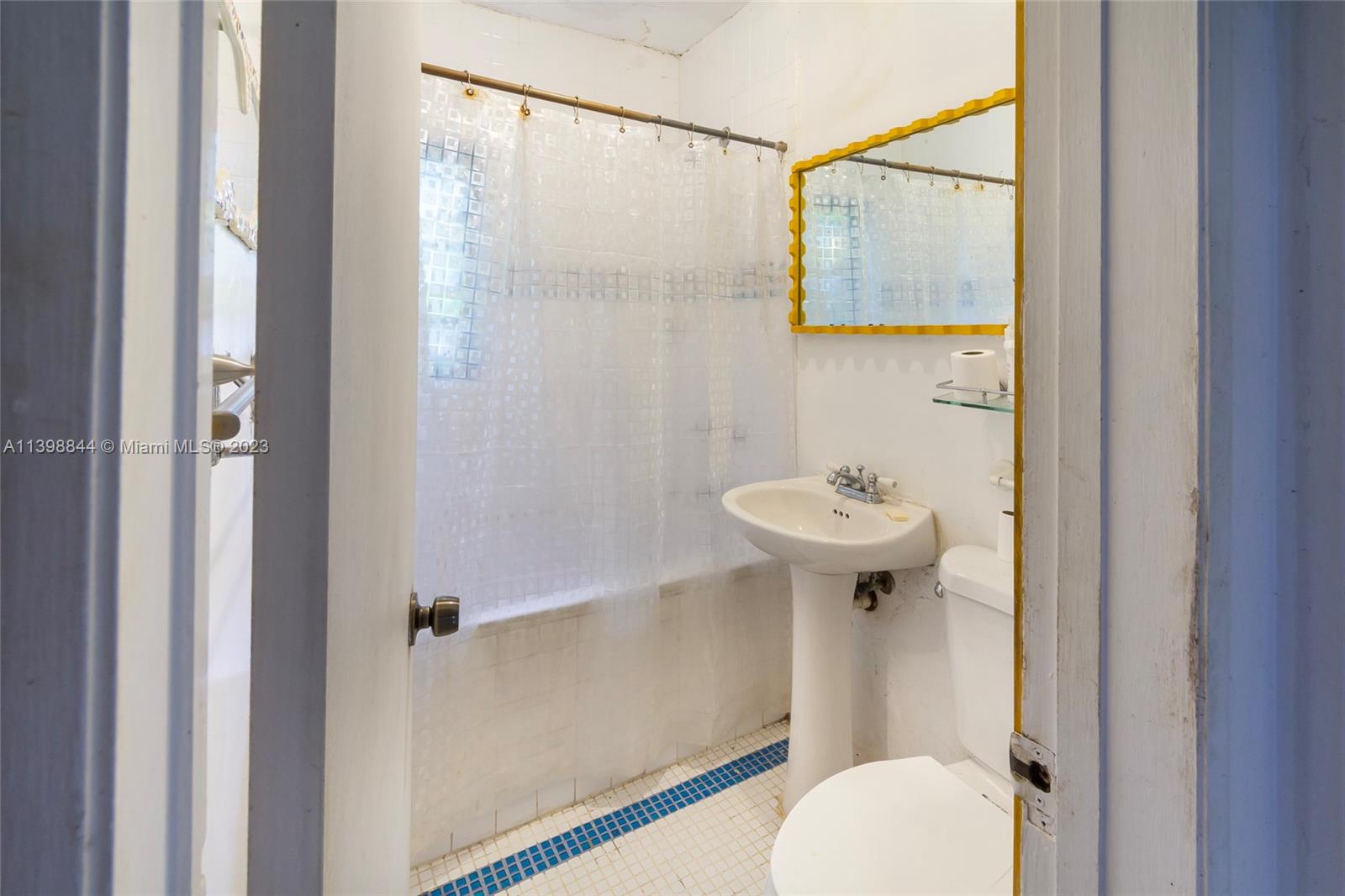6600 Southwest 45th Street Miami, FL 33155 - Photo 22 of 27 a bathroom with a sink a mirror and a toilet