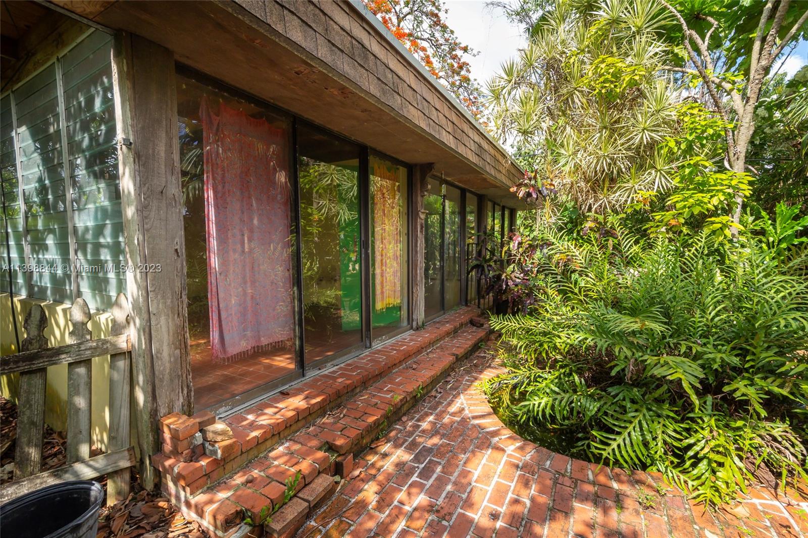 6600 Southwest 45th Street Miami, FL 33155 - Photo 27 of 27 a view of backyard with potted plants and a fountain