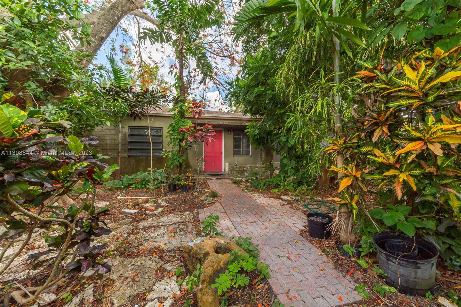 6600 Southwest 45th Street Miami, FL 33155 - Photo 6 of 27 a house with a tree in front of it