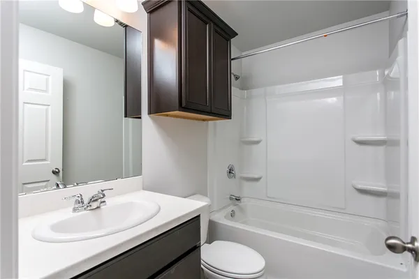 a bathroom with a toilet a sink and a bathtub