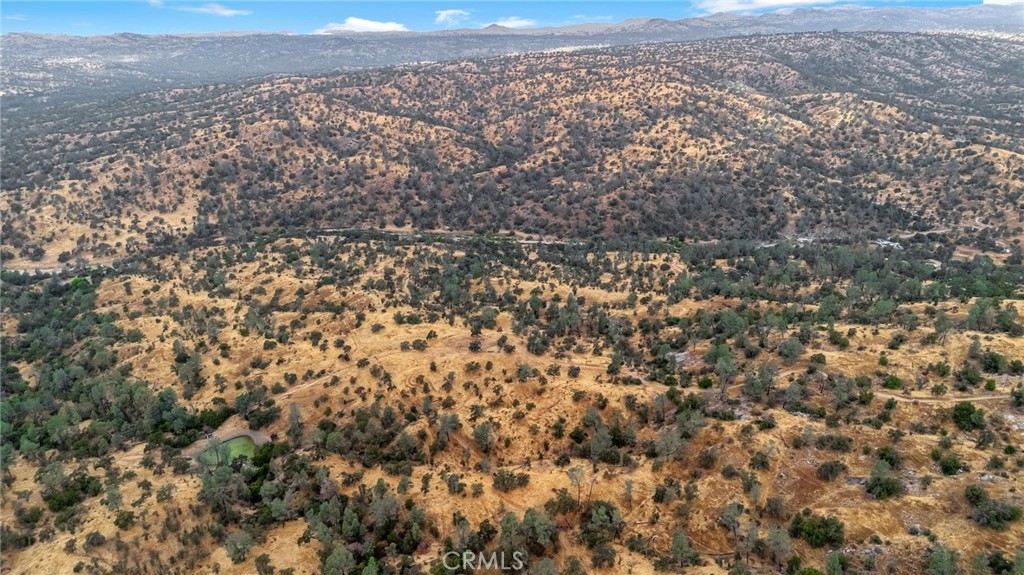 37449 Misty Ridge Road Raymond, CA 93653 - Photo 22 of 23 an aerial view of house with yard and mountain view in back