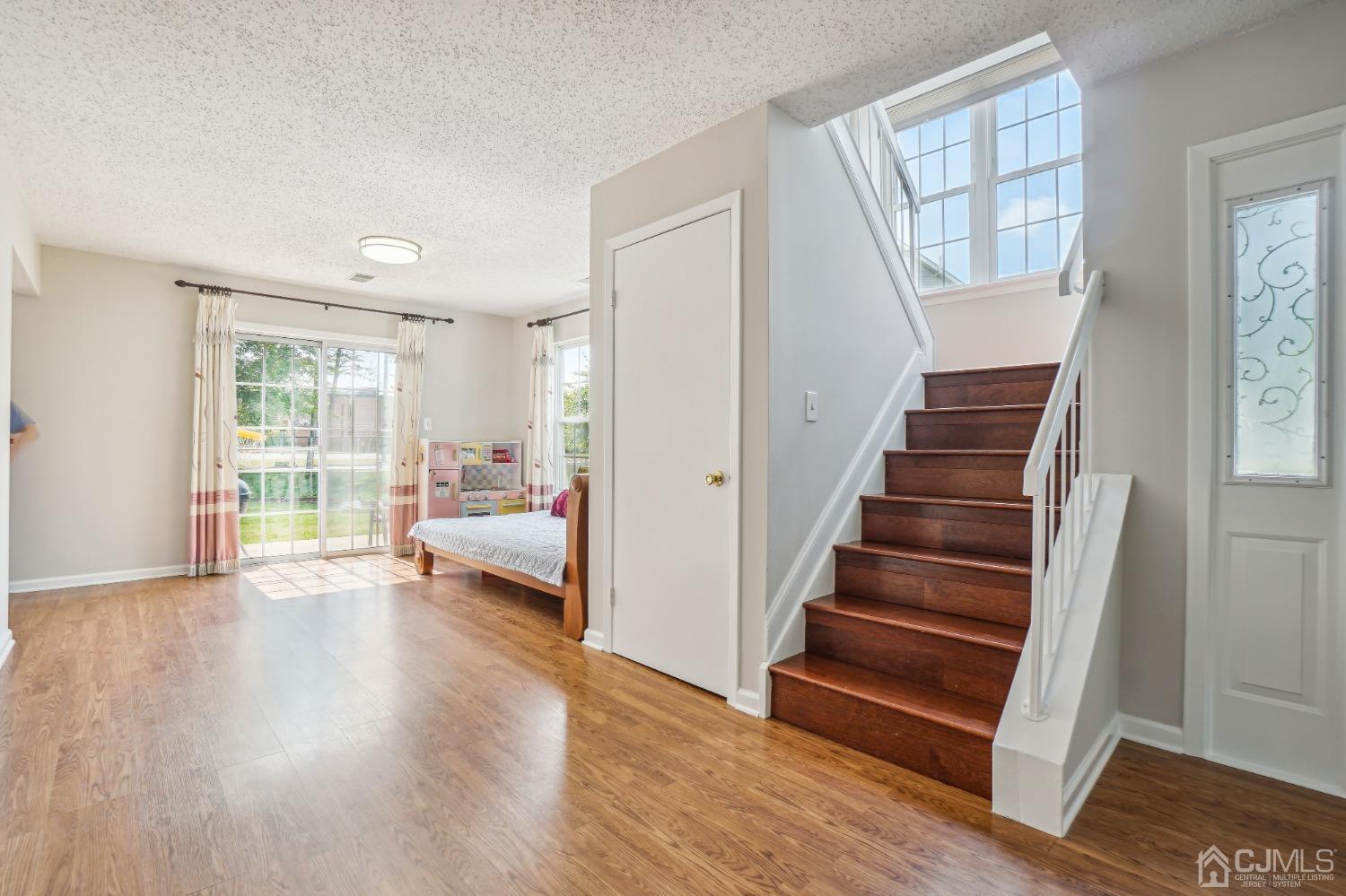 138 Nebula Road Piscataway, NJ 08854 - Photo 5 of 17 a view of an empty room window and wooden floor