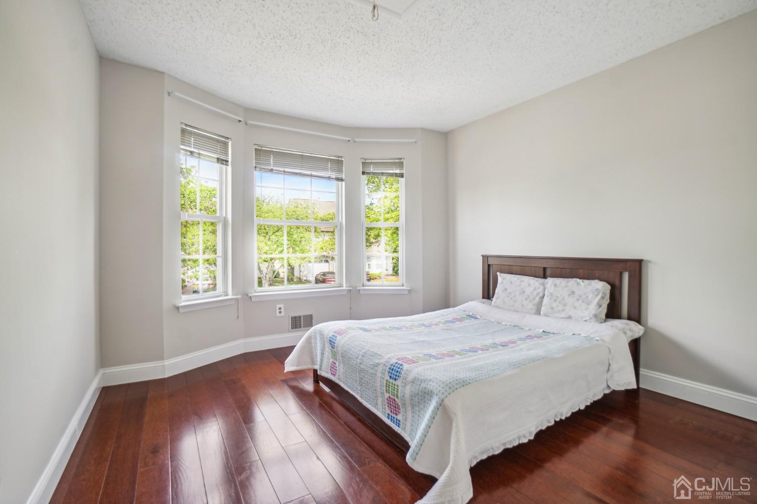 138 Nebula Road Piscataway, NJ 08854 - Photo 9 of 17 a bedroom with a bed and a large window