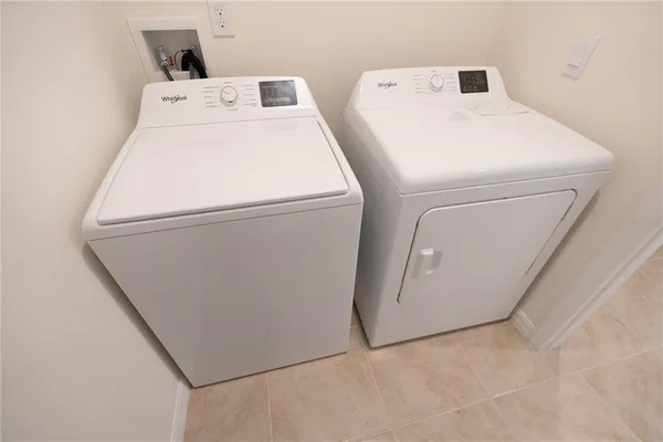 a utility room with dryer and washer