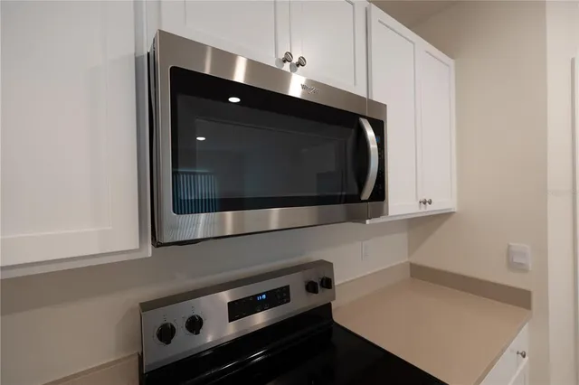 a view of wooden staircase with a hallway