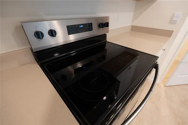 a refrigerator freezer sitting inside of a kitchen
