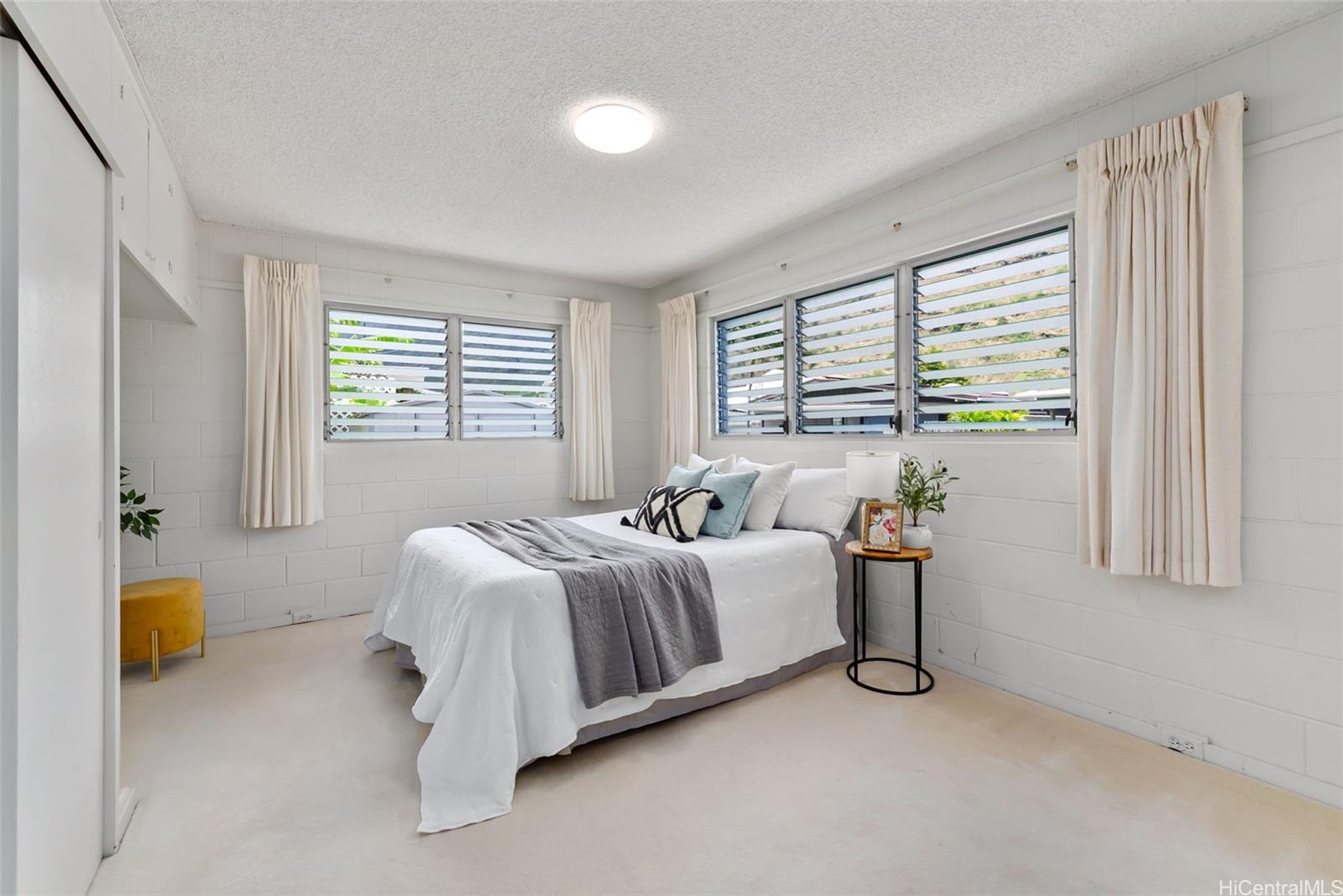 6014 Aimoku Street Honolulu, HI 96821 - Photo 20 of 25 Spacious, breezy primary bedroom at the end of the hall.