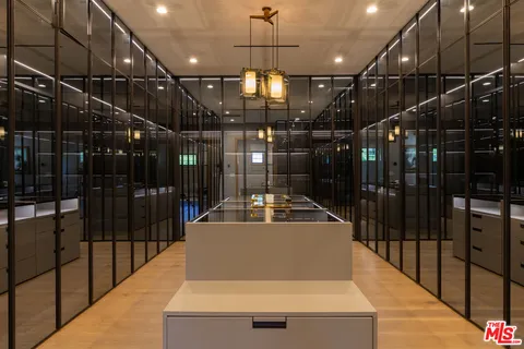 a view of a hall with wooden floor