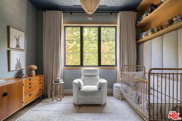 a living room with furniture and windows