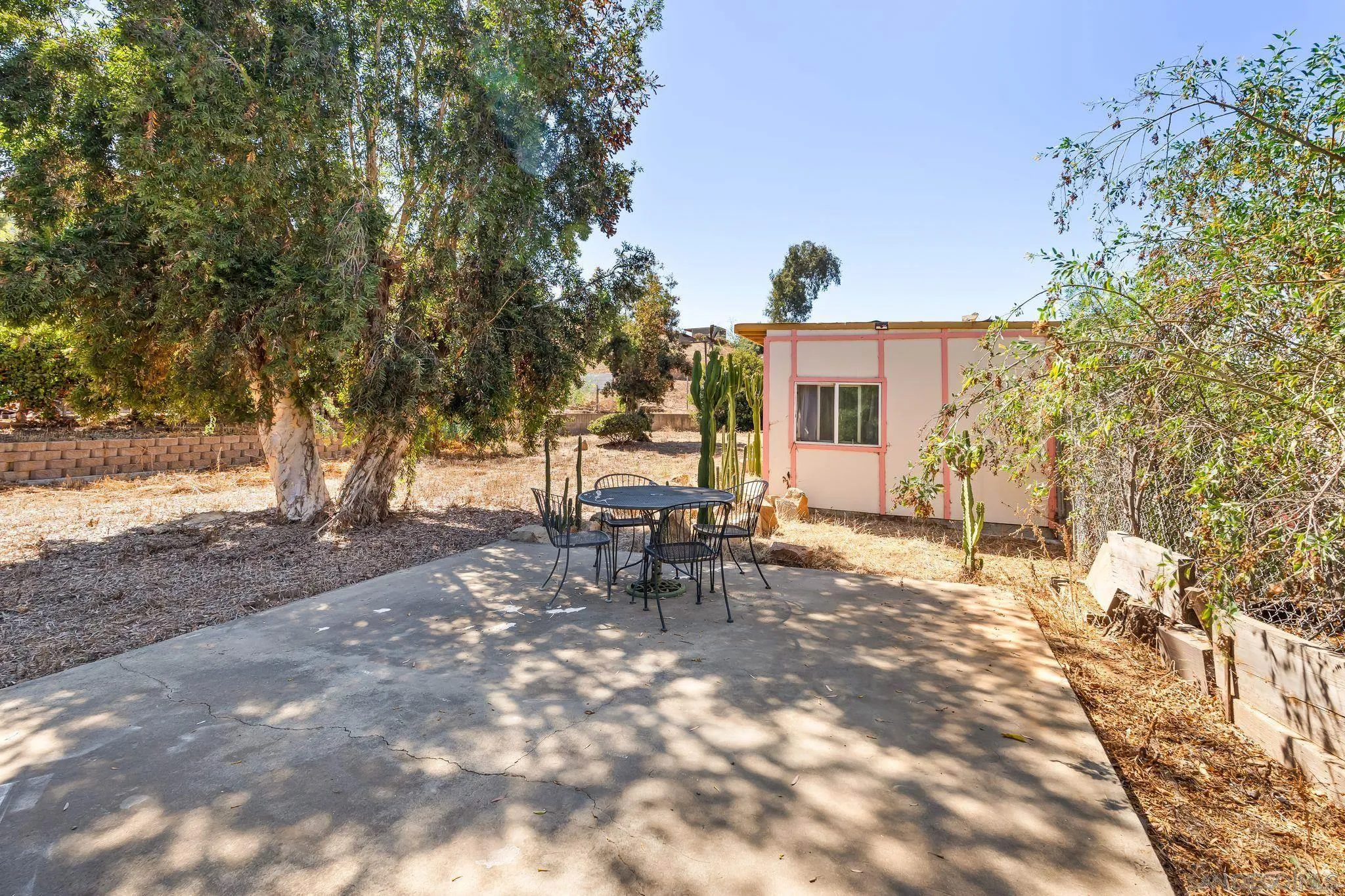 8968 Rocket Ridge Road Lakeside, CA 92040 - Photo 15 of 16 a view of a house with backyard and sitting area