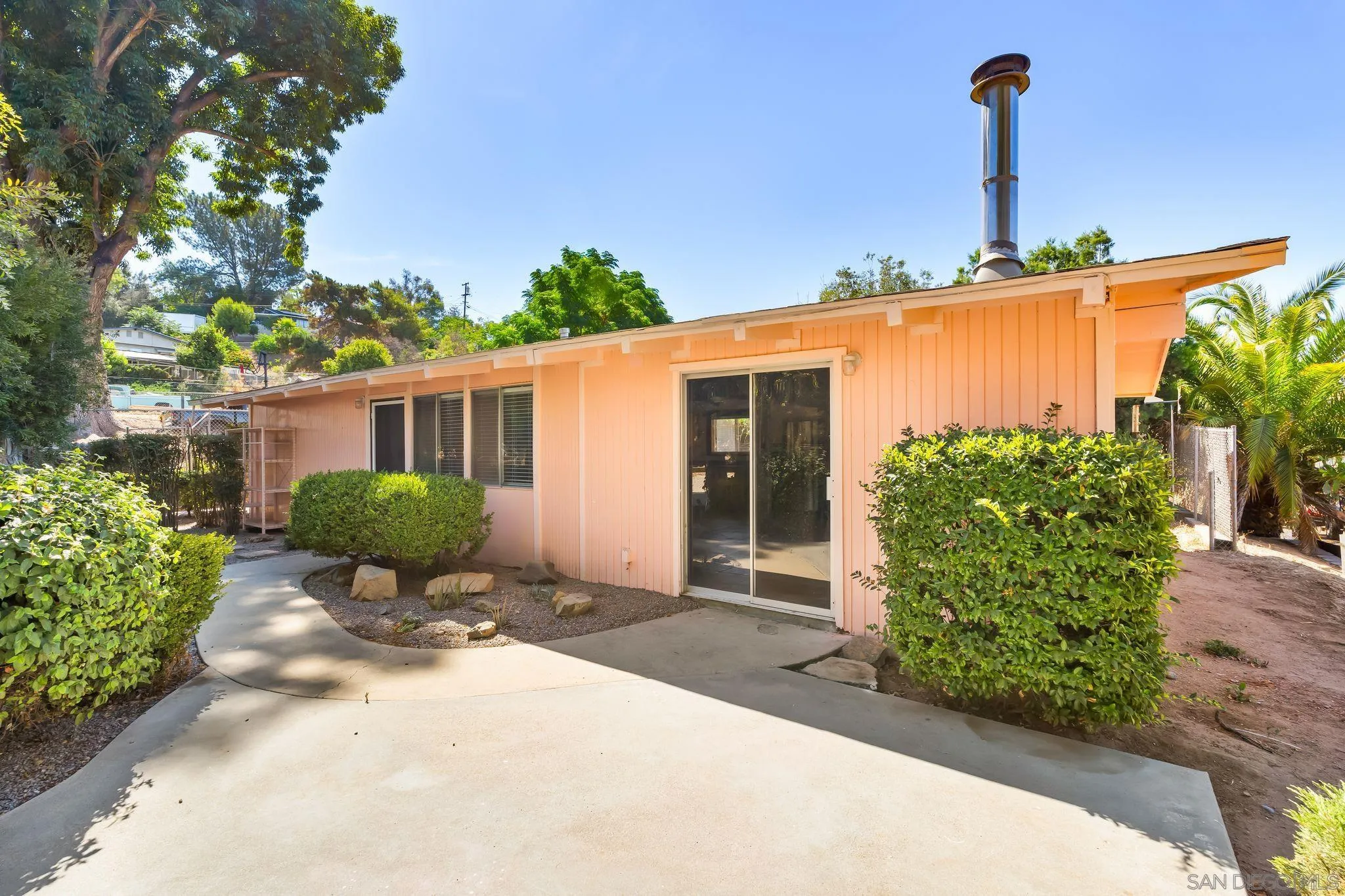 8968 Rocket Ridge Road Lakeside, CA 92040 - Photo 5 of 16 a front view of a house with garden