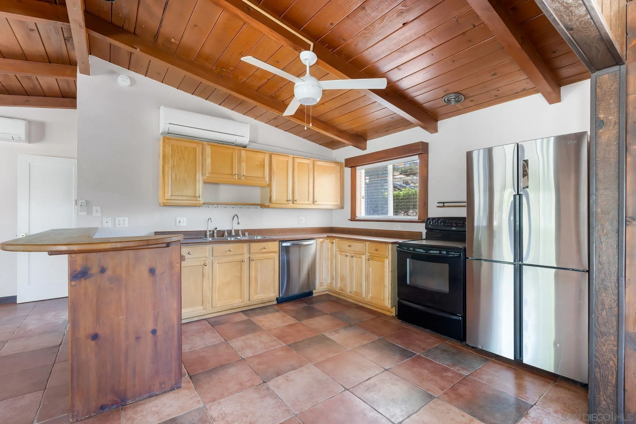 8968 Rocket Ridge Road Lakeside, CA 92040 - Photo 8 of 16 a kitchen with granite countertop a sink cabinets stainless steel appliances and a counter top space