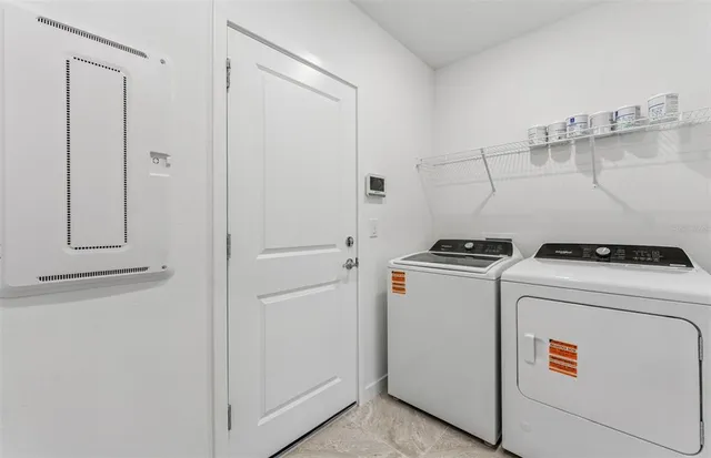 a view of swimming pool with outdoor seating and plants