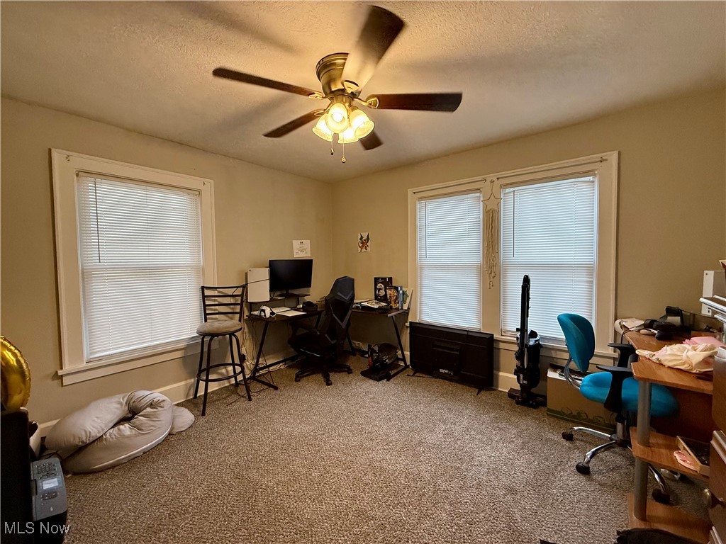 935 Ridge Road Northwest Canton, OH 44703 - Photo 17 of 32 Office area with a textured ceiling, light carpet, and ceiling fan