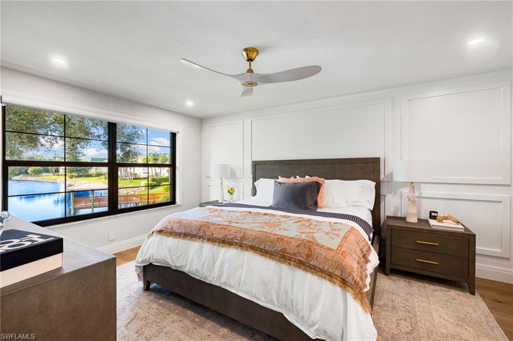 3135 Riviera Drive, Unit B205 Naples, FL 34103 - Photo 26 of 48 a bed room with a bed and a couch