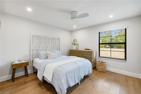 an aerial view of a houses with a yard