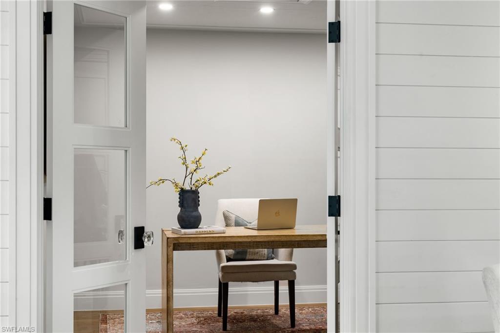 3135 Riviera Drive, Unit B205 Naples, FL 34103 - Photo 6 of 48 a view of workspace with a table