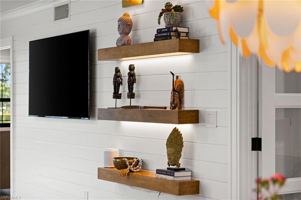 3135 Riviera Drive, Unit B205 Naples, FL 34103 - Photo 9 of 48 a bathroom with a sink and mirror