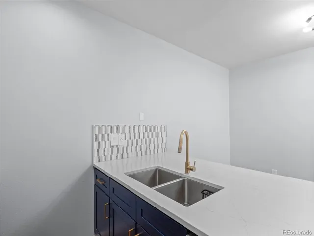 a kitchen with a sink and cabinets