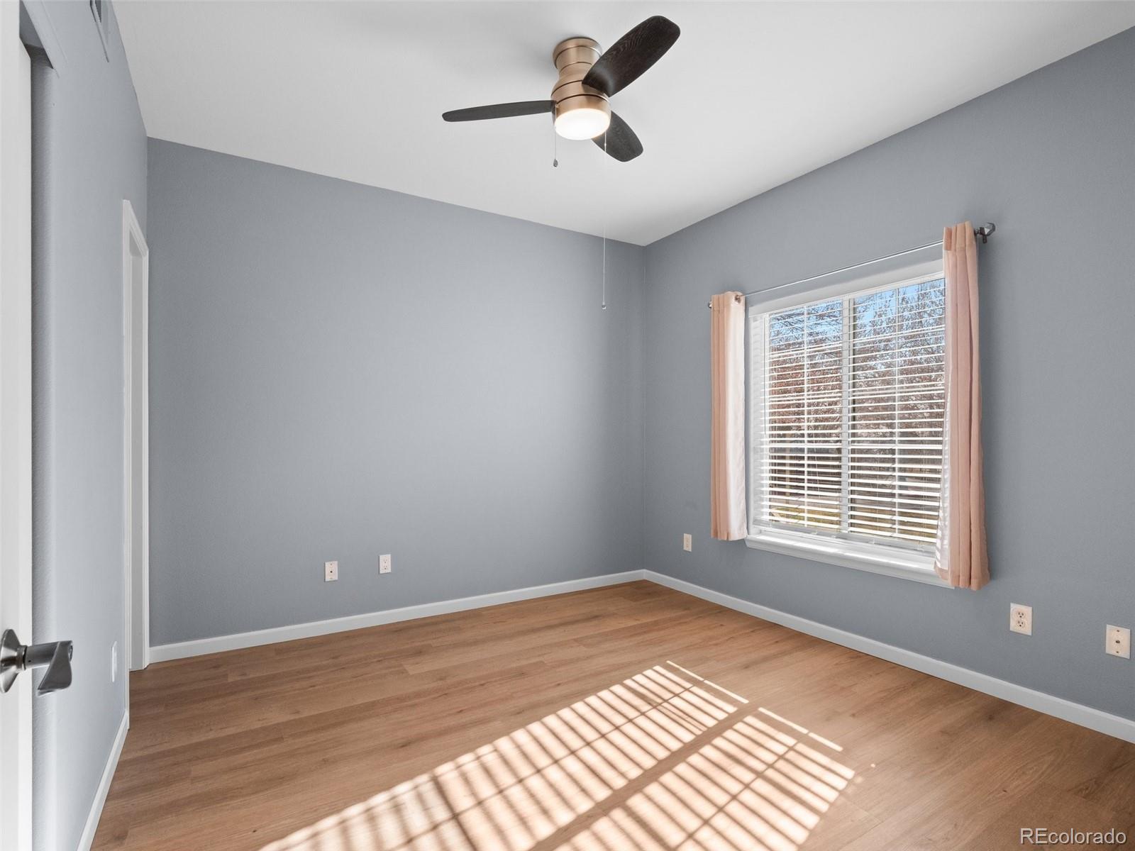 5335 Pecos Way, Unit 4 Denver, CO 80221 - Photo 15 of 25 a view of an empty room with a window