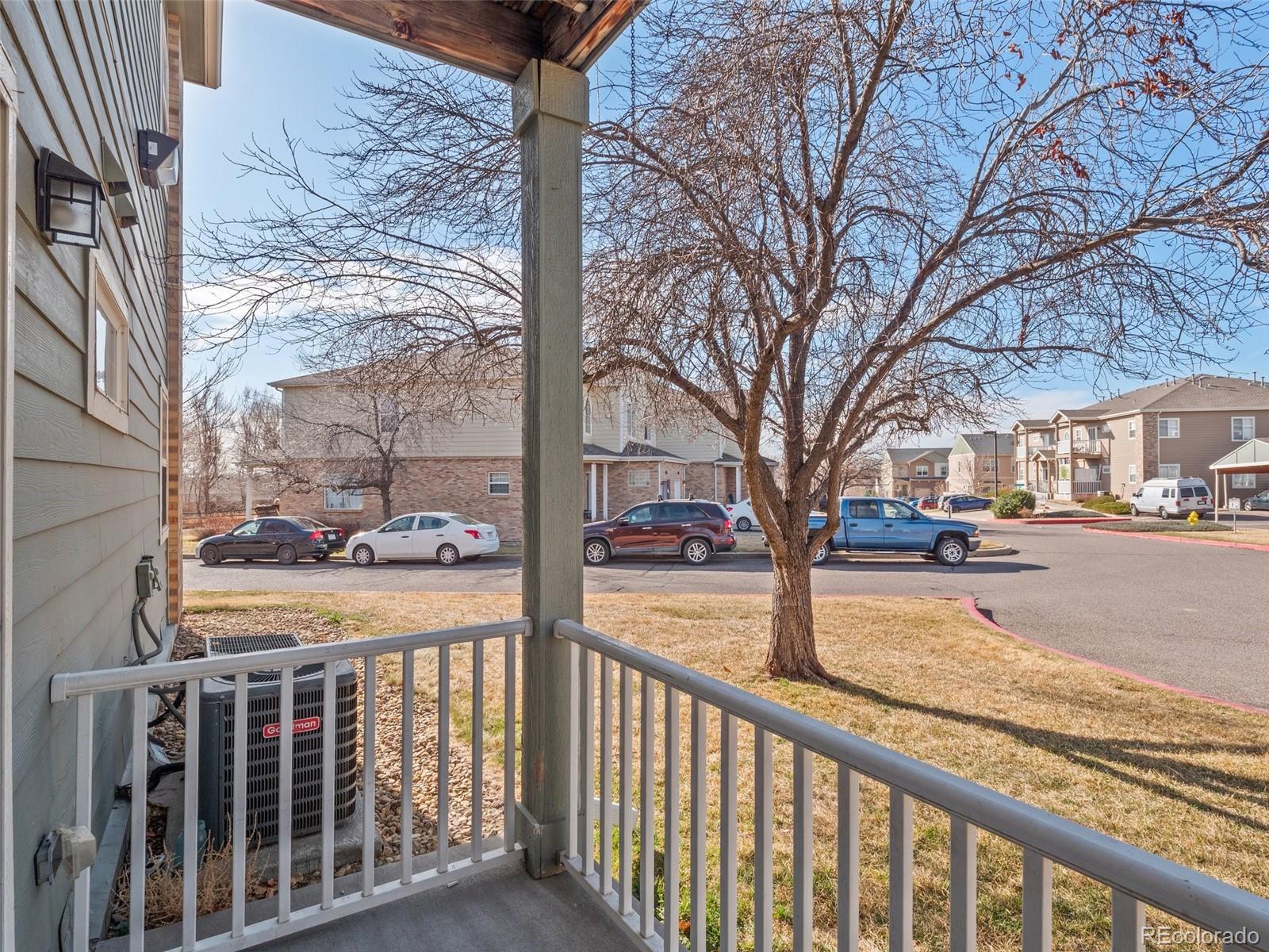 5335 Pecos Way, Unit 4 Denver, CO 80221 - Photo 18 of 25 a view of a street with cars on the road