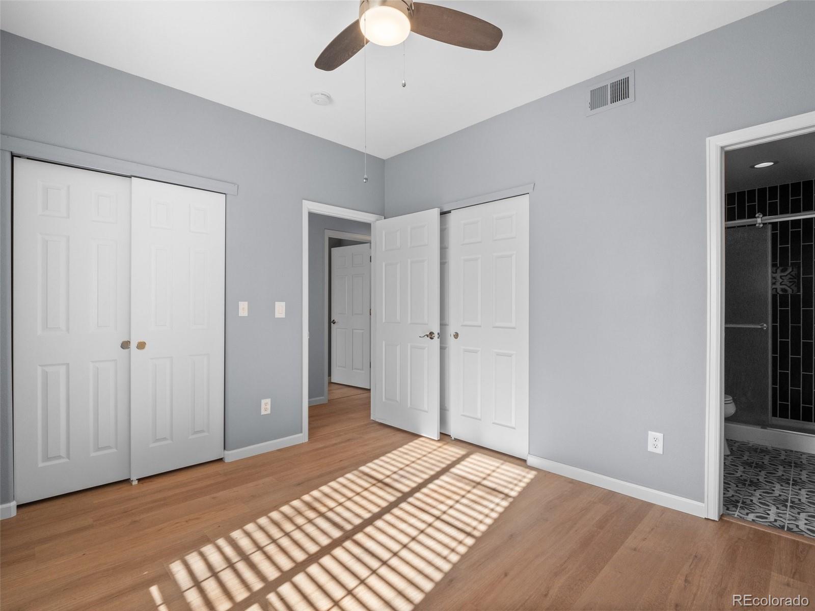 5335 Pecos Way, Unit 4 Denver, CO 80221 - Photo 21 of 25 a view of a room with wooden floor
